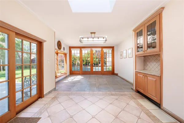 a view of an entryway with wooden floor