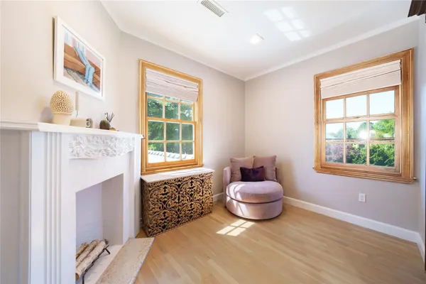 a spacious bedroom with a bed and a window