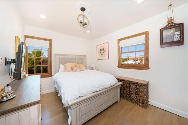 a bed room with a bed and a night stand