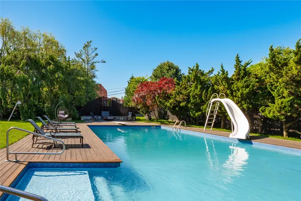 a view of a swimming pool with a patio