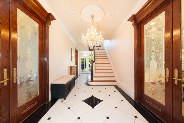 a view of a bathroom with entryway and wooden floor