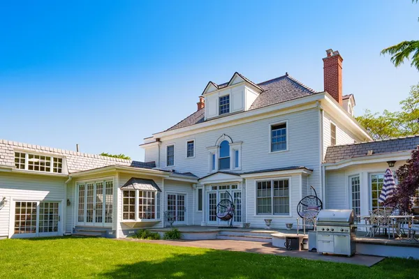 a front view of a house with a garden and porch