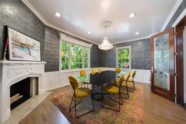 a view of a dining room with furniture window and wooden floor