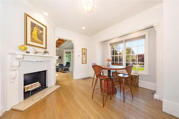 a view of a livingroom with furniture and a fireplace