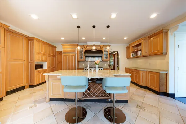 a kitchen with dining table and chairs