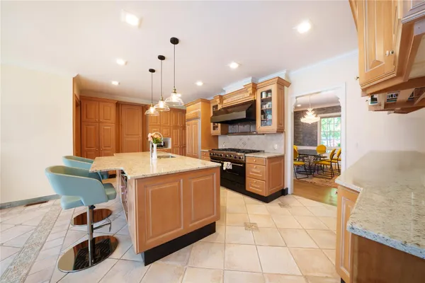 a kitchen with a sink a counter top space and stainless steel appliances