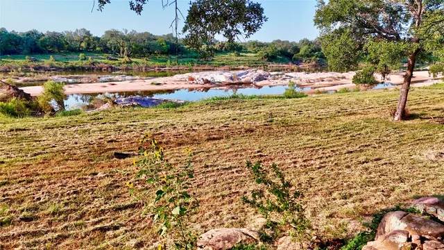 a view of a lake with houses in background