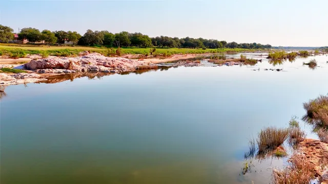 a view of a lake with beach
