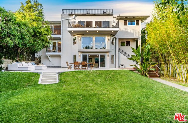 a view of a building with a yard