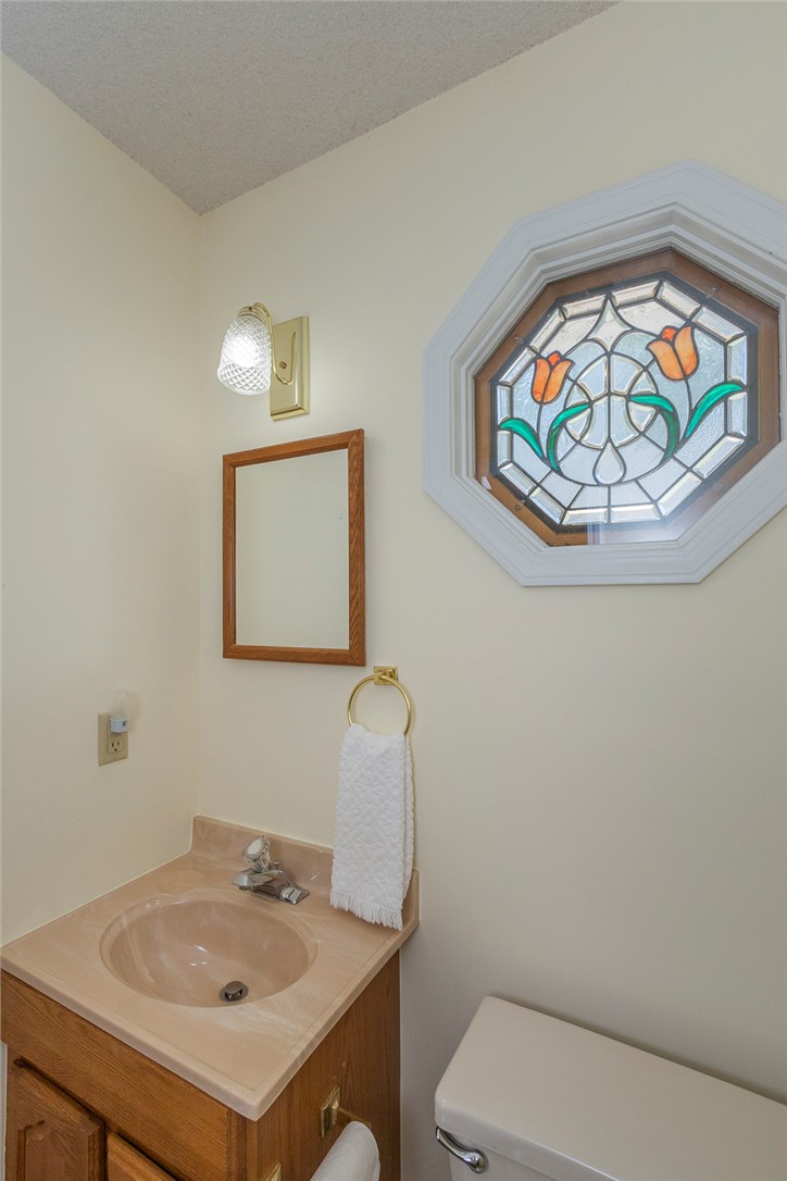 207 Laurel Ridge Road Anderson, SC 29621 - Photo 24 of 50 An octagonal stained glass window adds a distinctive touch to this well-appointed bathroom.