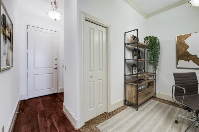a view of a livingroom with furniture and an empty room