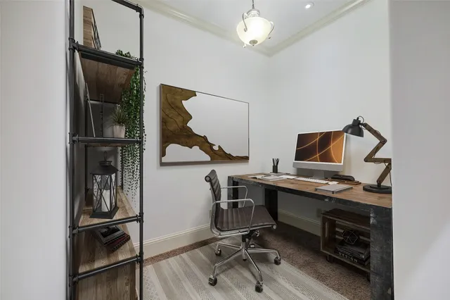 a view of a workspace with furniture and wooden floor
