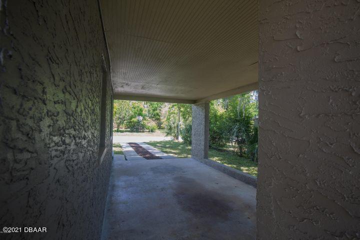 1089 Hampton Road Daytona Beach, FL 32114 - Photo 18 of 23 Carport with bonus storage room