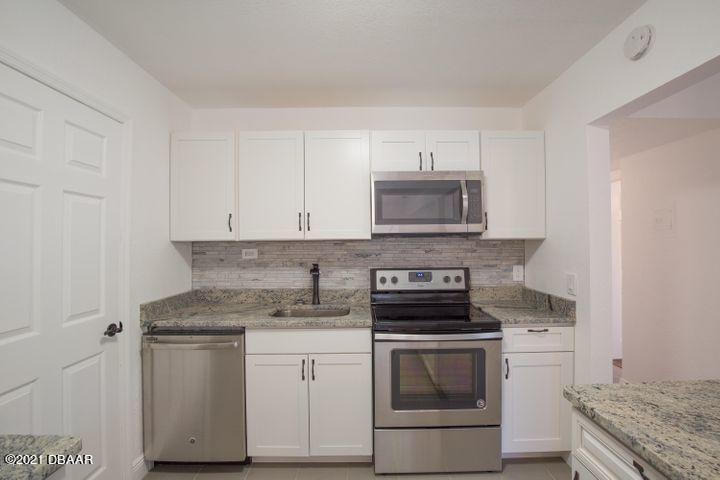 1089 Hampton Road Daytona Beach, FL 32114 - Photo 6 of 23 Newer cabinets, and appliances!