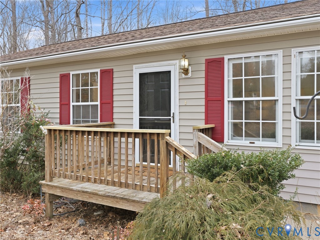 1637 Gardners Road Mineral, VA 23117 - Photo 3 of 30 a view of a house with a large window and wooden fence