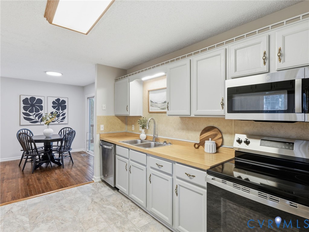 1637 Gardners Road Mineral, VA 23117 - Photo 7 of 30 a kitchen with appliances cabinets and dining table