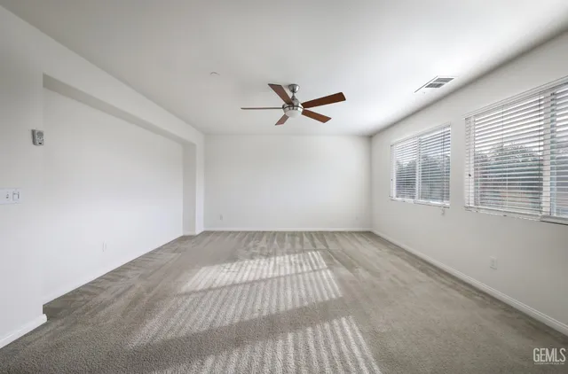 a view of an empty room and a window