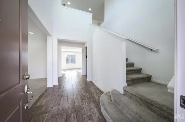 wooden floor in a hall with a window