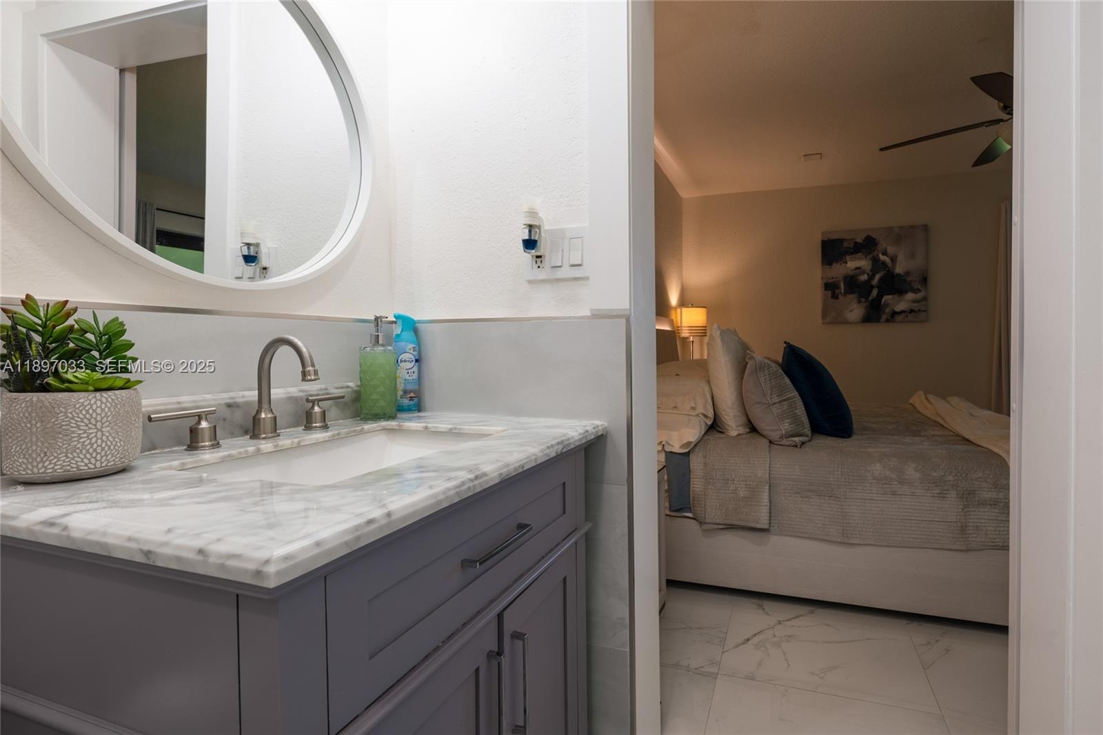 11381 Southwest 247th Terrace Homestead, FL 33032 - Photo 18 of 42 a bathroom with a granite countertop sink and a mirror
