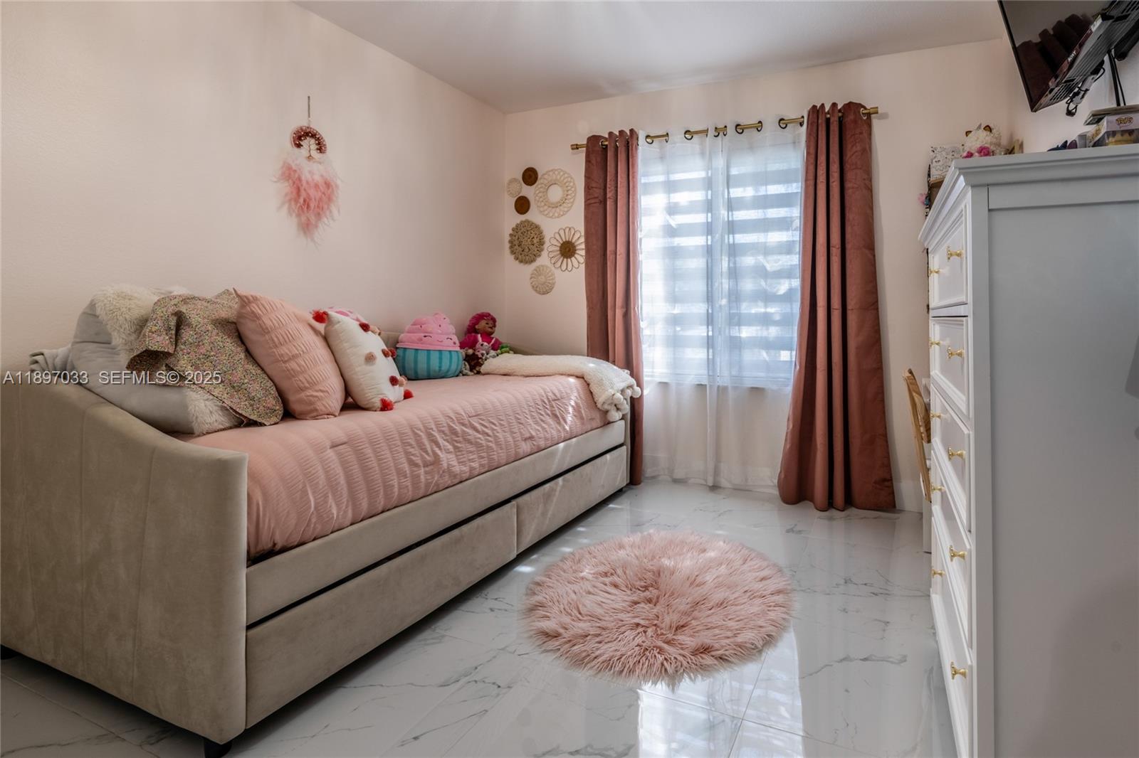 11381 Southwest 247th Terrace Homestead, FL 33032 - Photo 22 of 42 a living room with a bed furniture and a flat tv screen