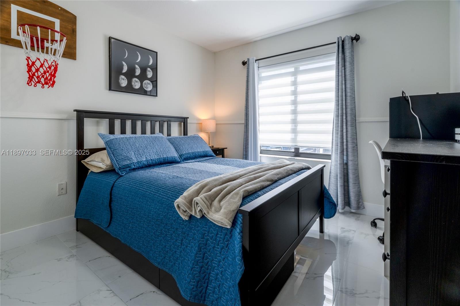 11381 Southwest 247th Terrace Homestead, FL 33032 - Photo 23 of 42 a bedroom with a bed and a window