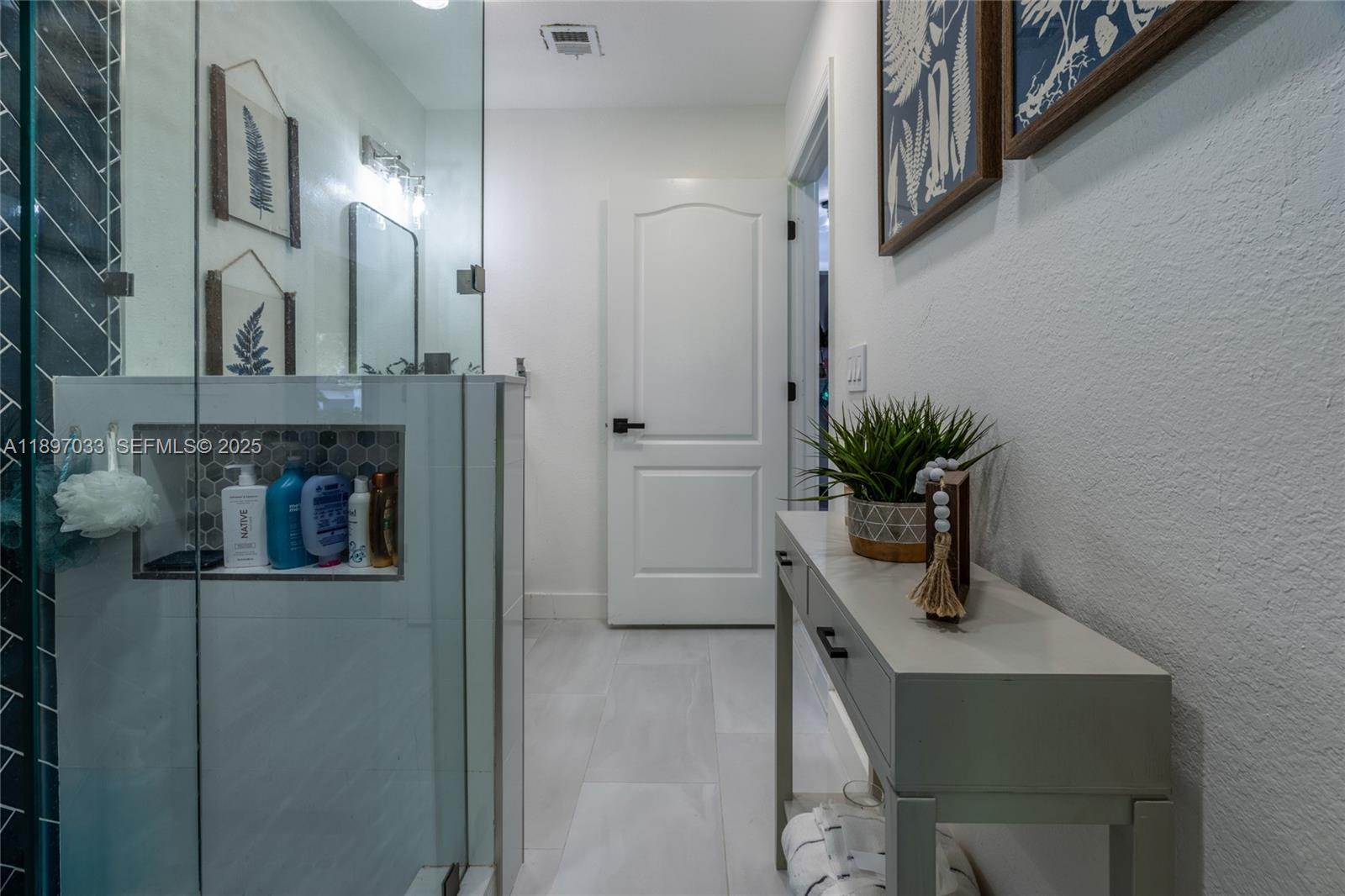 11381 Southwest 247th Terrace Homestead, FL 33032 - Photo 27 of 42 a view of bathroom with a potted plant on a sink