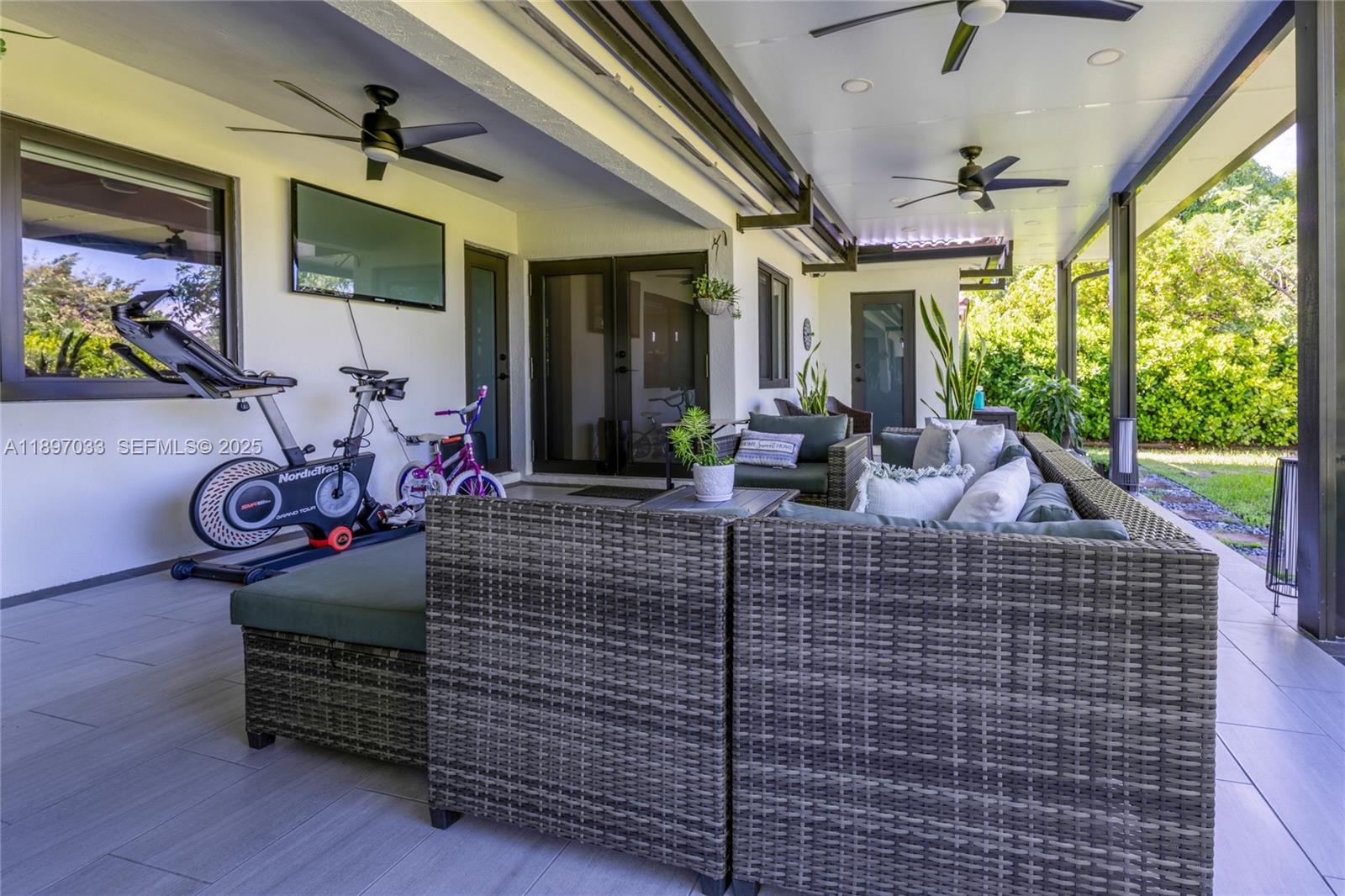 11381 Southwest 247th Terrace Homestead, FL 33032 - Photo 31 of 42 a view of a chairs and table in the patio