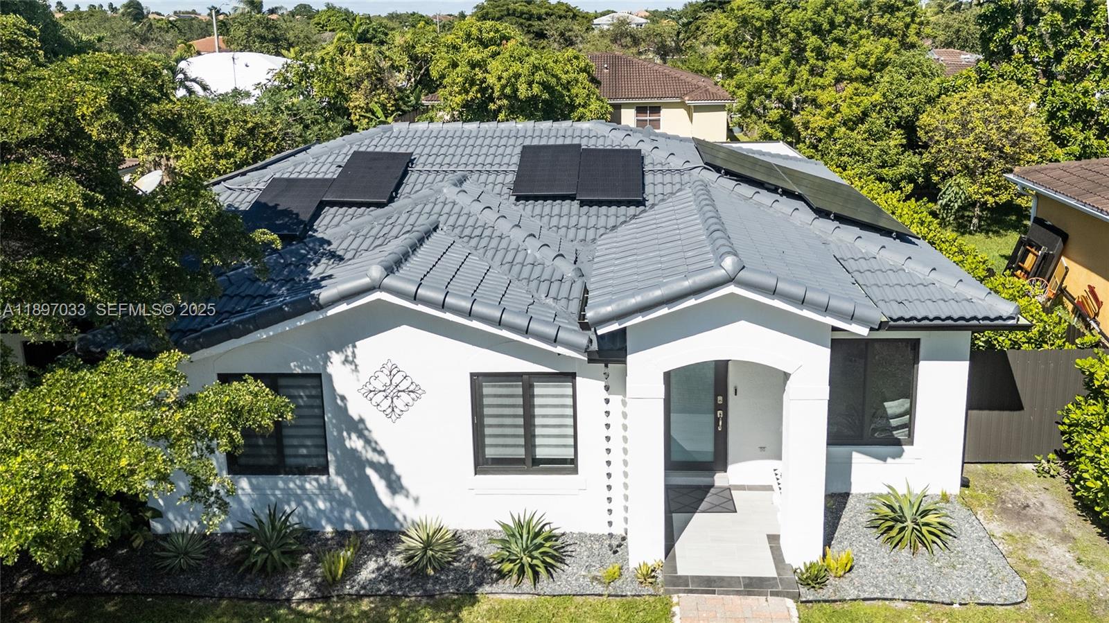 11381 Southwest 247th Terrace Homestead, FL 33032 - Photo 39 of 42 a view of a house with a yard