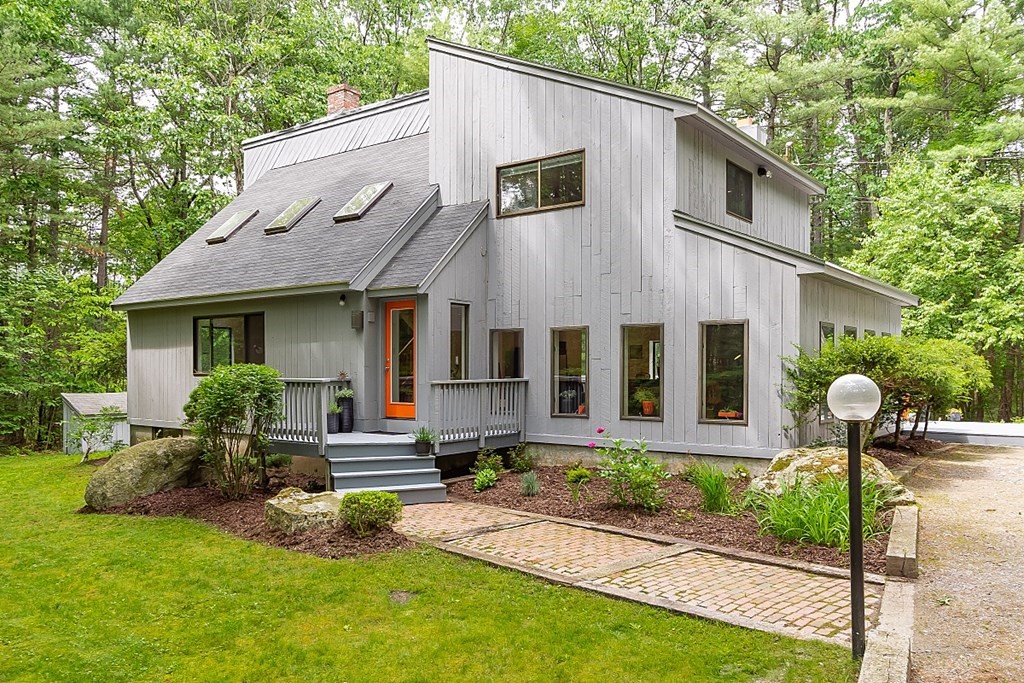 309 Littleton Road Harvard, MA 01451 - Photo 1 of 41 a front view of house with yard and green space