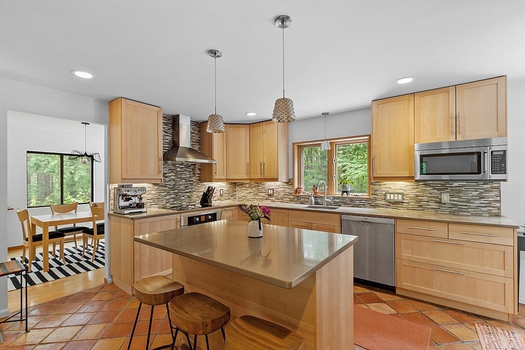 309 Littleton Road Harvard, MA 01451 - Photo 12 of 41 a kitchen with stainless steel appliances granite countertop a stove a sink and a refrigerator