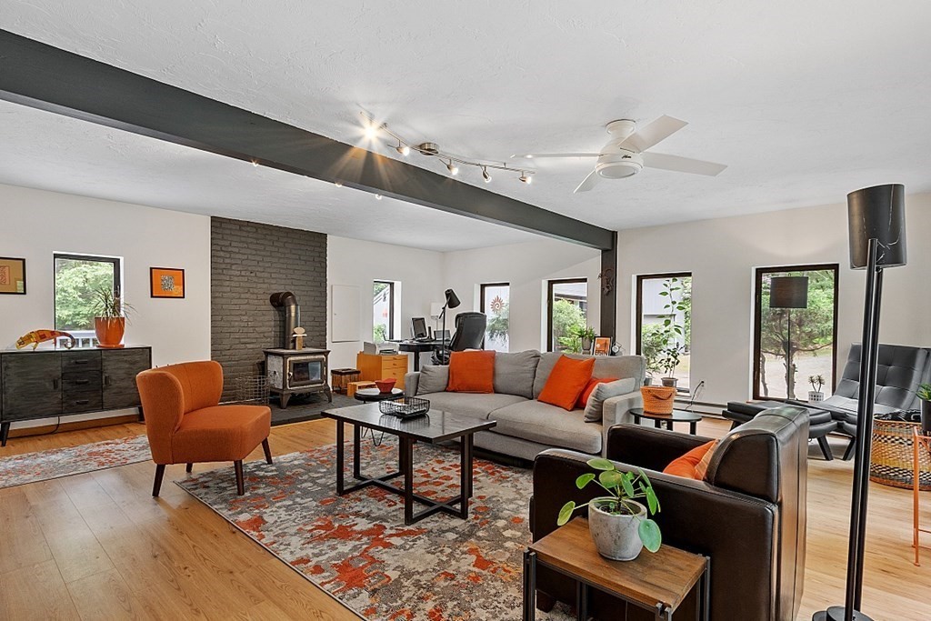 309 Littleton Road Harvard, MA 01451 - Photo 15 of 41 a living room with furniture ceiling fan and a rug
