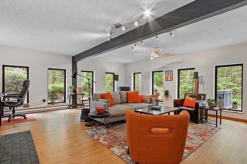 309 Littleton Road Harvard, MA 01451 - Photo 16 of 41 a living room with furniture and a large window