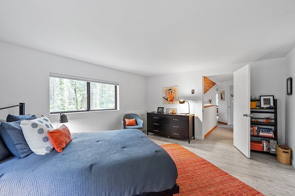309 Littleton Road Harvard, MA 01451 - Photo 25 of 41 a bedroom with a bed and wooden floor