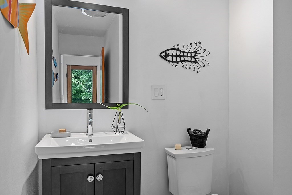 309 Littleton Road Harvard, MA 01451 - Photo 29 of 41 a bathroom with a toilet a sink and a mirror