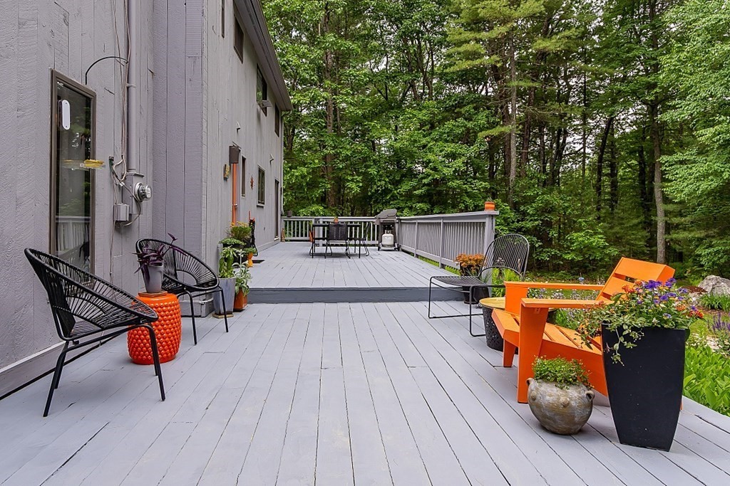 309 Littleton Road Harvard, MA 01451 - Photo 37 of 41 an outdoor sitting area with furniture and wooden floor