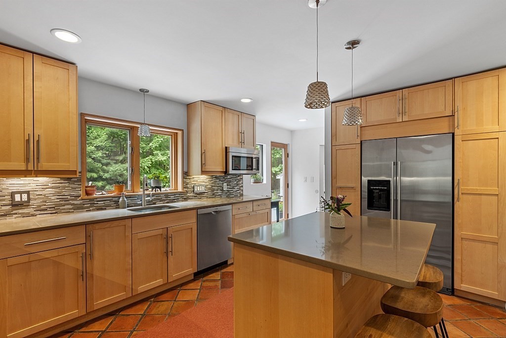 309 Littleton Road Harvard, MA 01451 - Photo 10 of 41 a kitchen with stainless steel appliances granite countertop sink stove refrigerator and cabinets