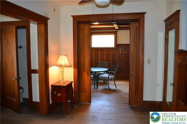 a view of room with furniture and wooden floor