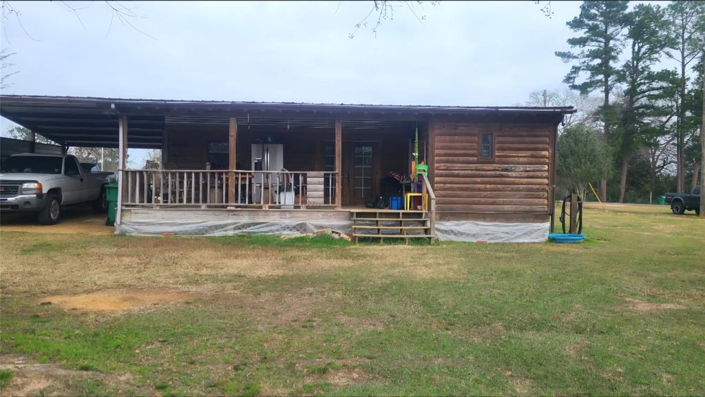 211 Holly Springs Church Road Coushatta, LA 71019 - Photo 3 of 9 a front view of a house with a garden