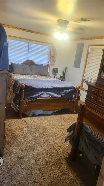211 Holly Springs Church Road Coushatta, LA 71019 - Photo 8 of 9 a bedroom with a bed and wooden floor