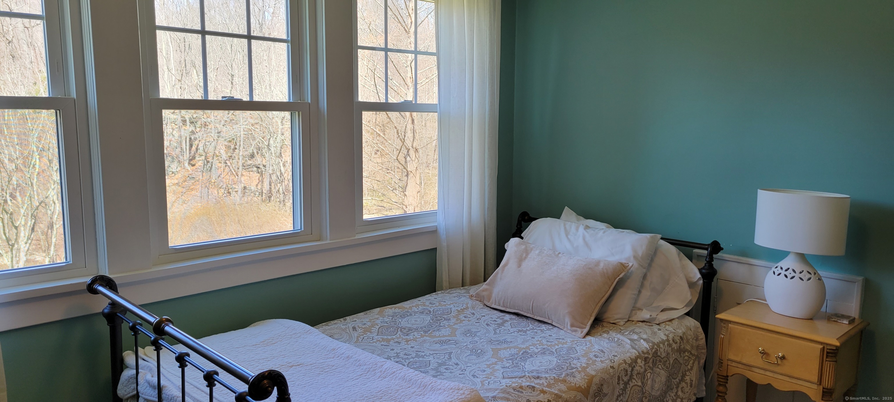 81 West Mountain Road Ridgefield, CT 06877 - Photo 14 of 25 a bedroom with a bed and window