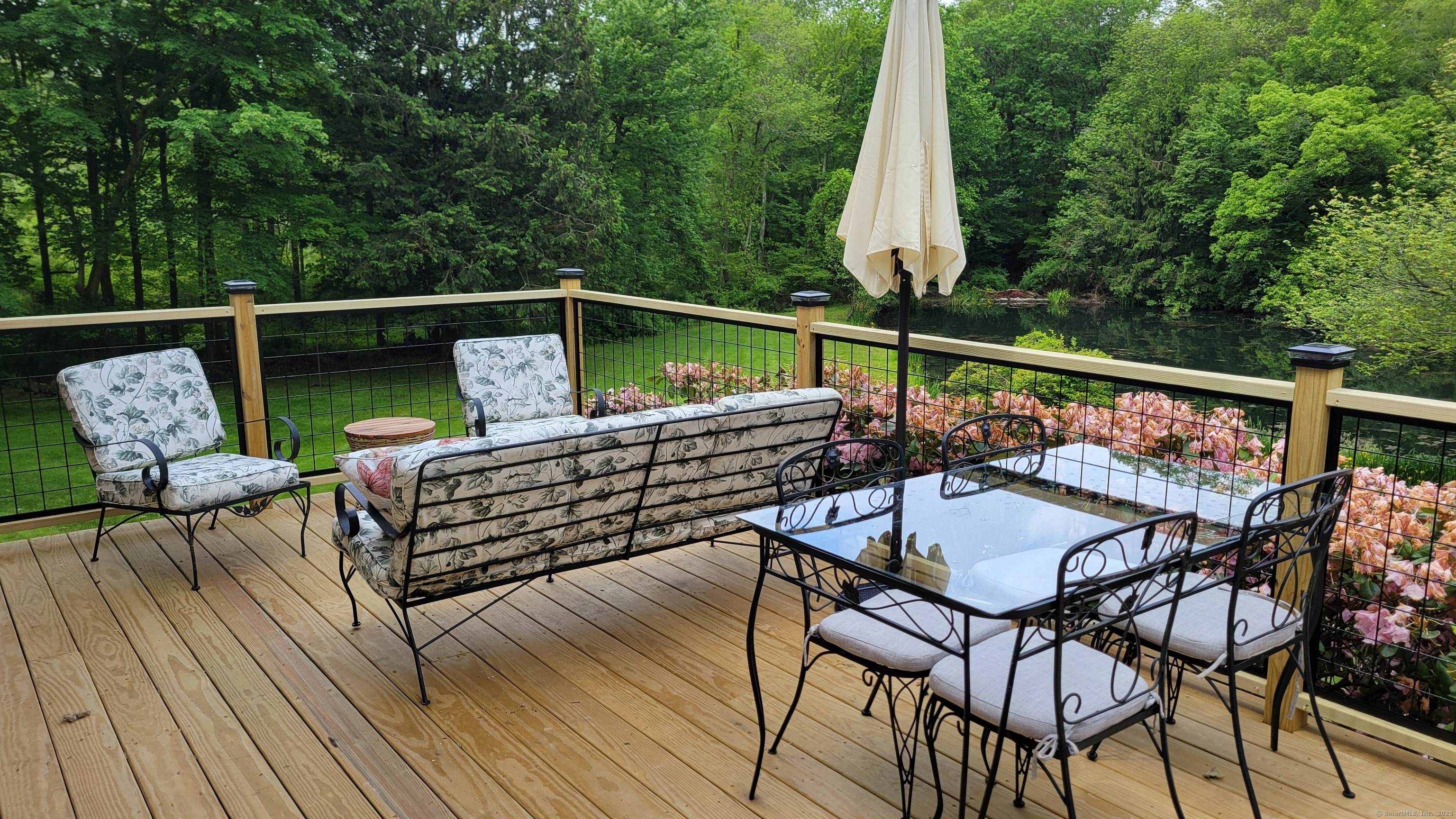 81 West Mountain Road Ridgefield, CT 06877 - Photo 16 of 25 a view of deck with furniture and trees
