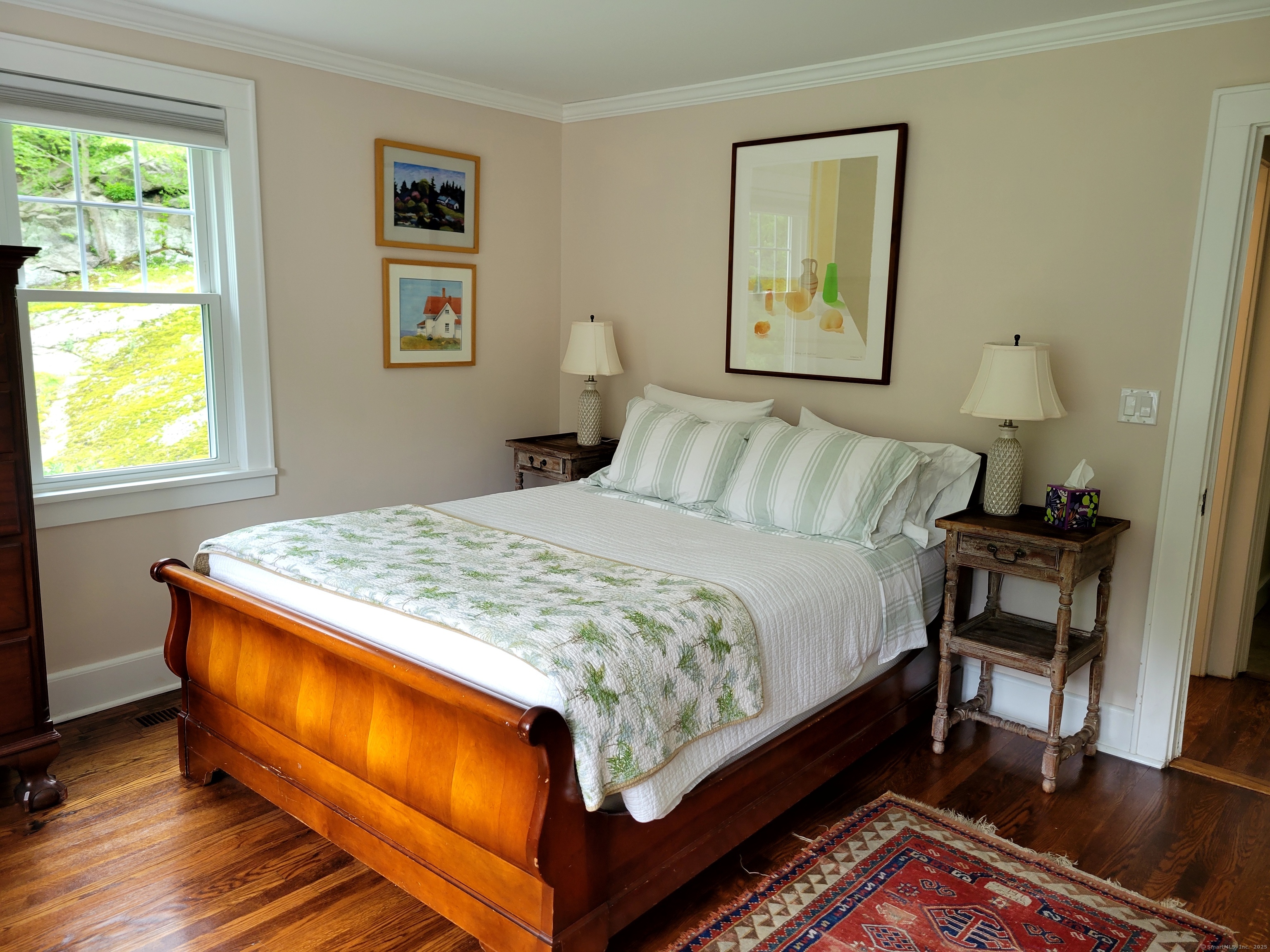 81 West Mountain Road Ridgefield, CT 06877 - Photo 9 of 25 a bed sitting in a bedroom next to a window