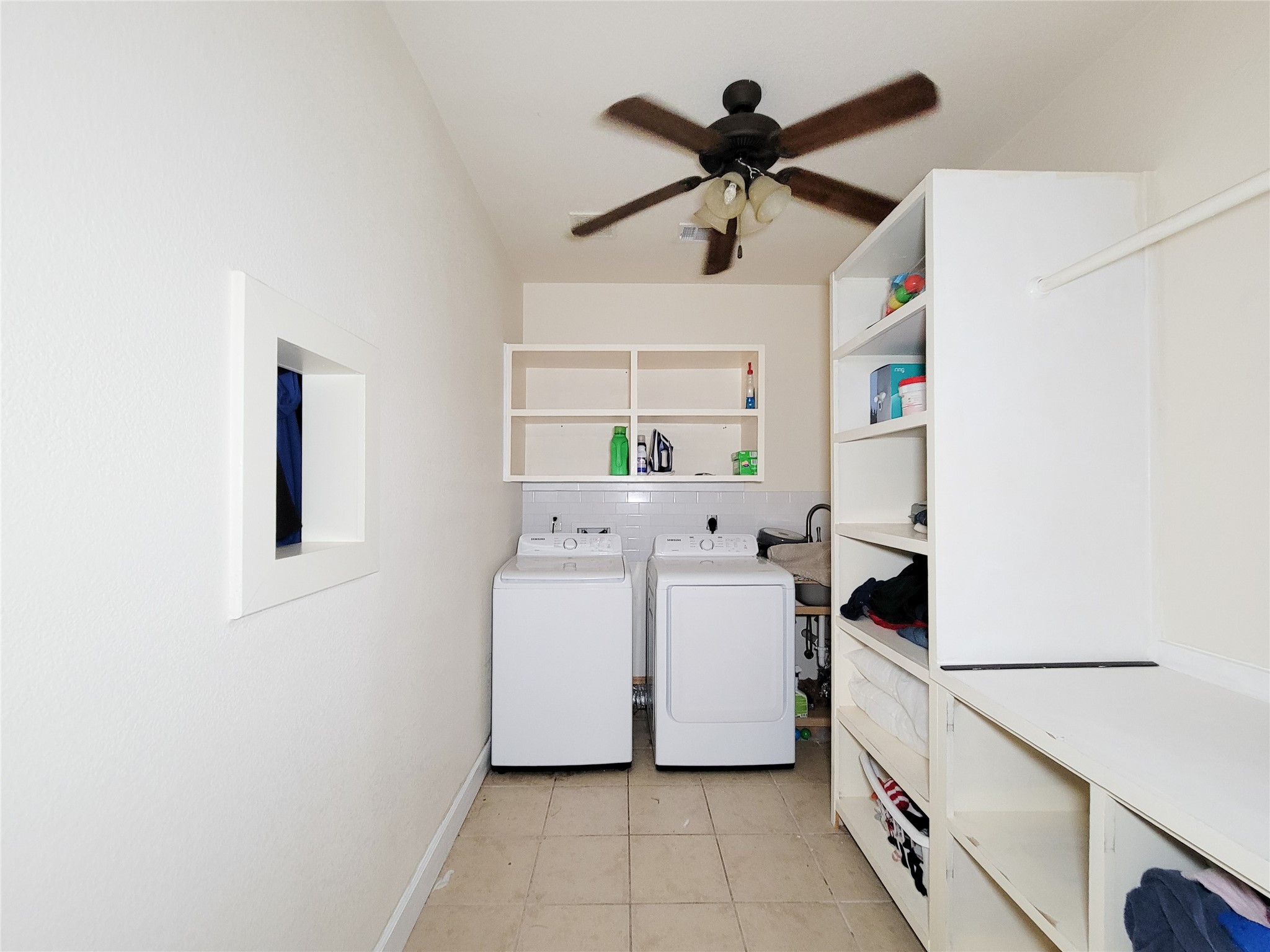 2011 Old Ox Road Spring, TX 77386 - Photo 15 of 38 a utility room with dryer and washer
