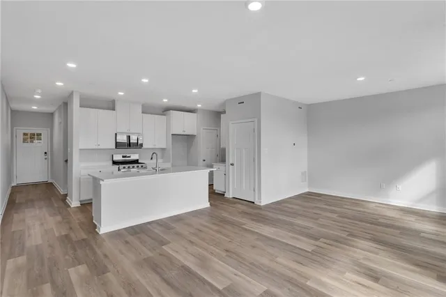 a view of kitchen with wooden floor
