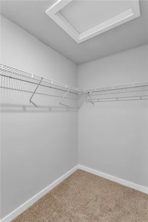 a bathroom with a double vanity sink and mirror with shower