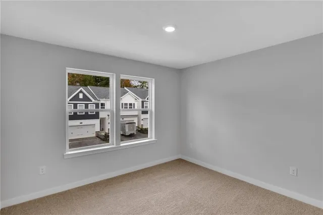 a view of an empty room and a window