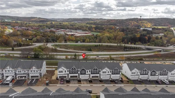 a view of city and lake with mountain