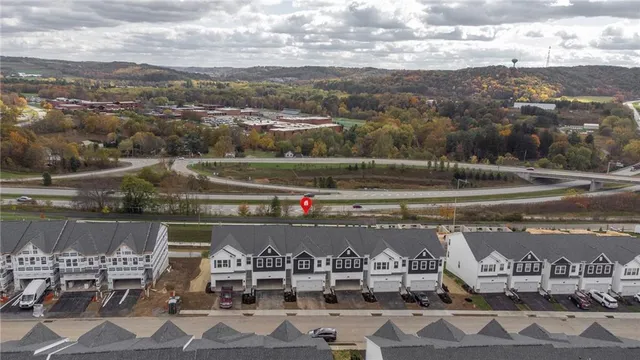 a view of city and lake with mountain