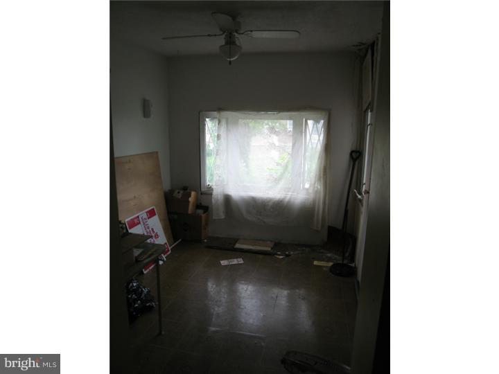 7041 Clinton Road Upper Darby, PA 19082 - Photo 4 of 6 a room with a window and a projector