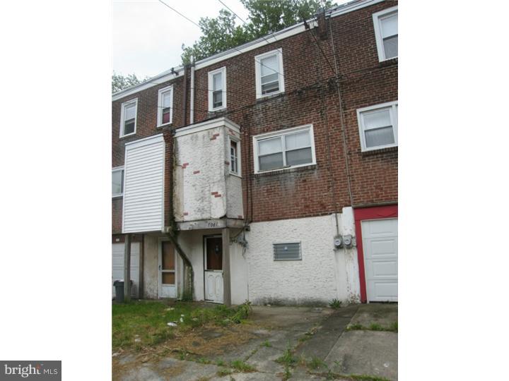 7041 Clinton Road Upper Darby, PA 19082 - Photo 5 of 6 a front view of a house with white fence